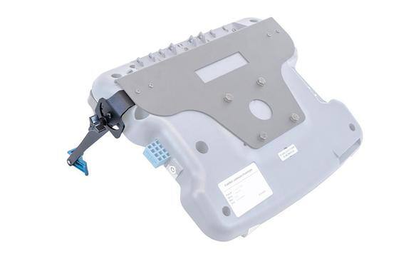 Gray electronic device with various ports and a barcode label.
