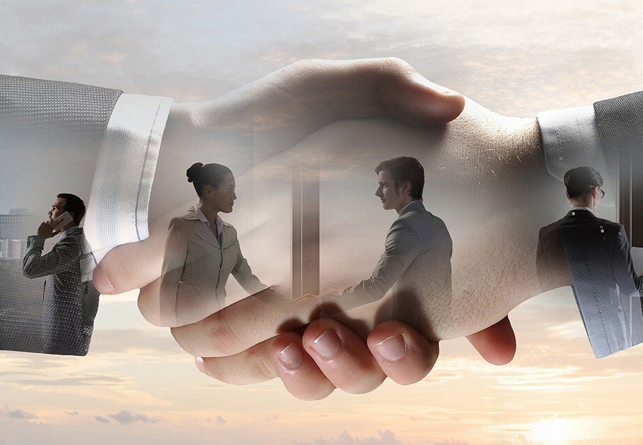Graphic of two hands shaking and overlayed on the hands are business people interacting