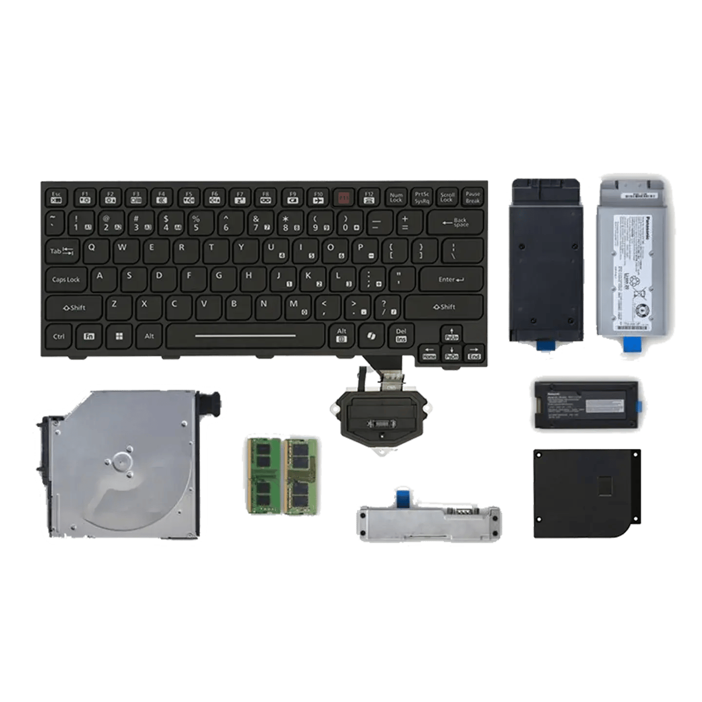 Clavier d’un ordinateur portable TOUGHBOOK 40 avec diverses modules d’extension, batteries et cartes de connexions.