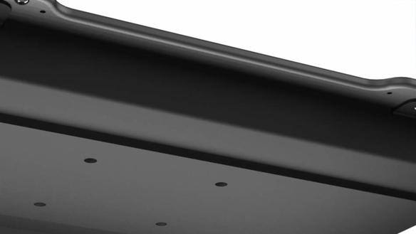 Black cradle for TOUGHBOOK 40 with mounting holes.