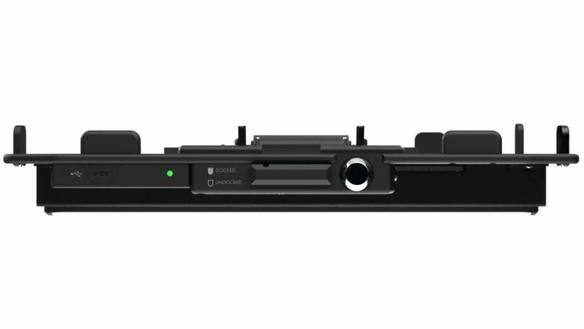 Black docking station with multiple ports and indicator lights.