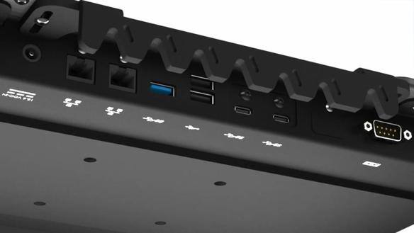 Black docking station with multiple ports and symbols.