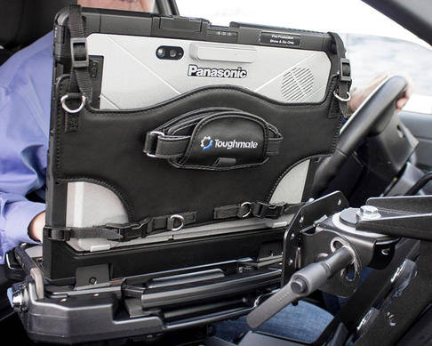 Rotating hand strap on a rugged Panasonic laptop case in a vehicle setting.