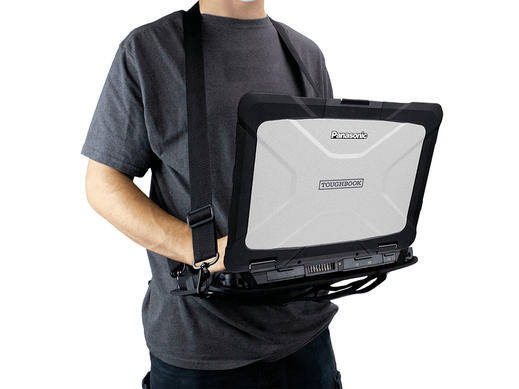 Man holding a Panasonic Toughbook in a harness.